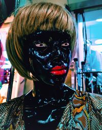 Close-up portrait of woman with mask