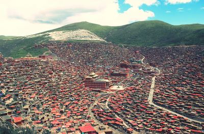 High angle view of building and mountains against sky