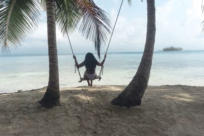 Full length of man on beach against sky