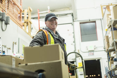 Portrait of smiling worker in warehouse