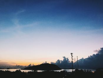 Scenic view of silhouette mountains against sky at sunset