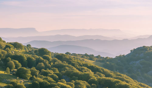 Scenic view of mountains against sky during sunset