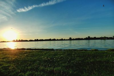 Scenic view of lake against sky during sunset