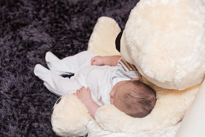 High angle view of baby lying down