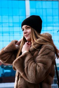 Low angle view of woman in warm clothing