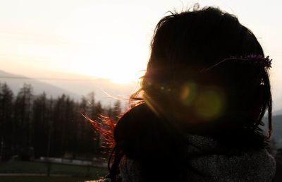 Rear view of woman against sky