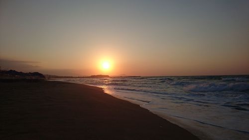 View of beach at sunset