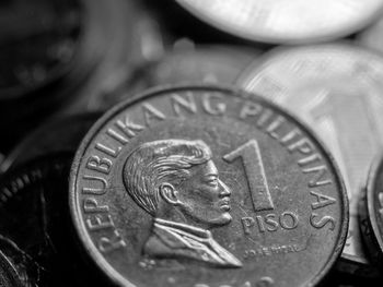 Close-up of coins on black background