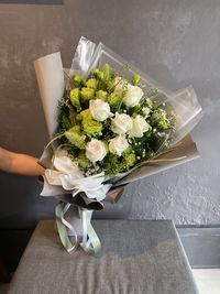 High angle view of woman holding flower bouquet