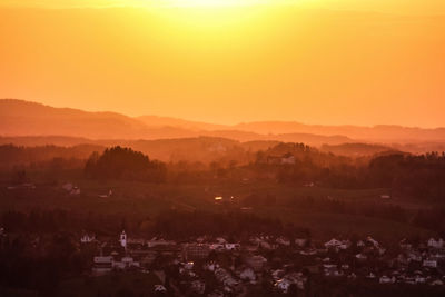 Aerial view of townscape against sky during sunset