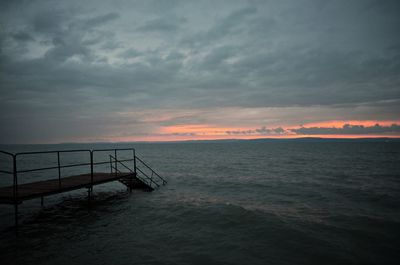 Scenic view of sea against sky at sunset