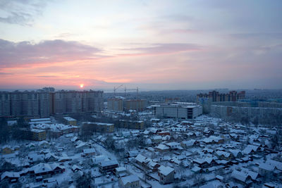 High angle view of buildings against sky during sunset