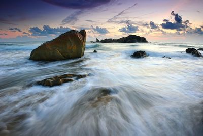 Scenic view of sea against sky at sunset