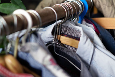Close-up of clothes hanging on display in store