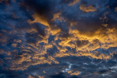 Low angle view of dramatic sky during sunset