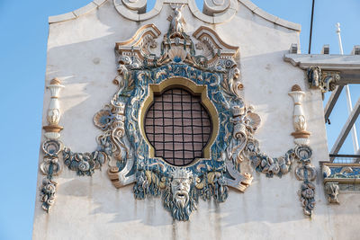 Low angle view of decoration on wall of building