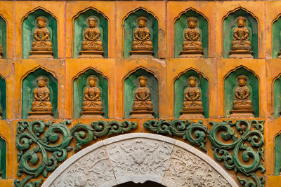 Low angle view of ornate sculpture on building