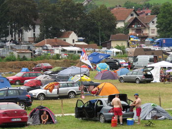 High angle view of people on street amidst field