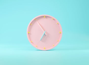 Close-up of clock against blue background