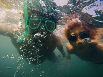 Portrait of man swimming in sea