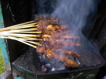 High angle view of food on barbecue grill