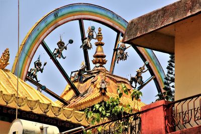 Low angle view of statue against sky