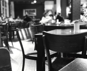 Empty chairs and table in cafe