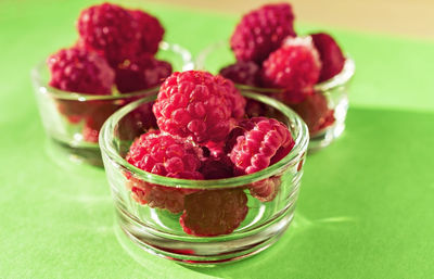 Close-up of strawberries in glass bowl on table