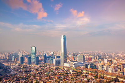 Aerial view of modern buildings in city against sky