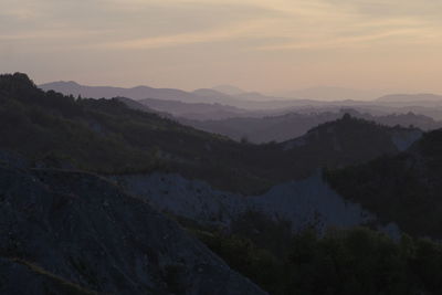 Scenic view of mountains against sky during sunset