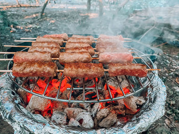 High angle view of meat on barbecue grill