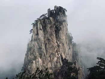 Panoramic view of rocky mountains against sky