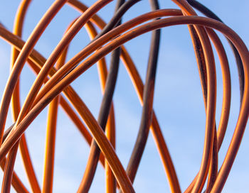 Low angle view of metallic structure against sky