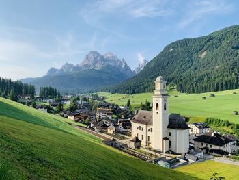 Houses and mountains against sky