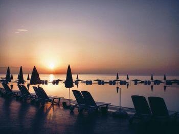 Scenic view of infinity pool during sunset