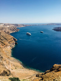 High angle view of sailboats on sea against clear sky