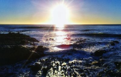 Scenic view of sea against sky at sunset