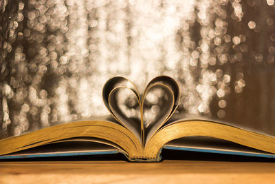 Close-up of heart shape book on table