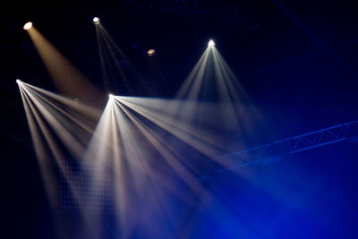 Stage lights glowing in the dark. live music festival concept background