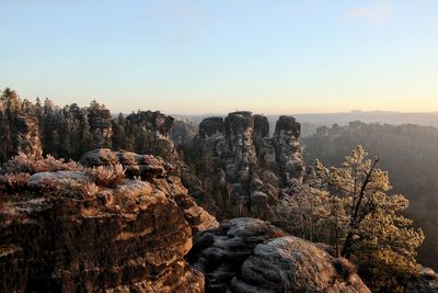 Scenic view of landscape against sky during sunrise