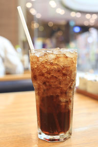 Close-up of drink in glass on table at restaurant