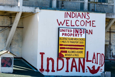 Information sign on building in city