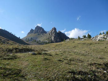 Scenic view of landscape and mountains against sky