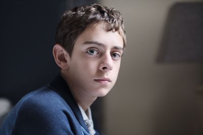 Close-up portrait of boy at home