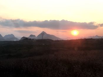 Scenic view of silhouette landscape against sky during sunset