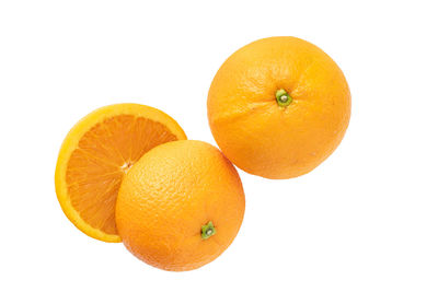 High angle view of orange fruit on white background