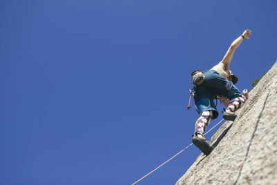 Man climbing without hands
