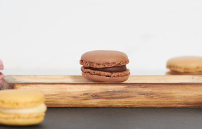 Close-up of cake on table against white background