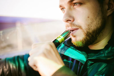 Man smoking electronic cigarette