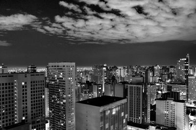 High angle view of illuminated buildings in city against sky